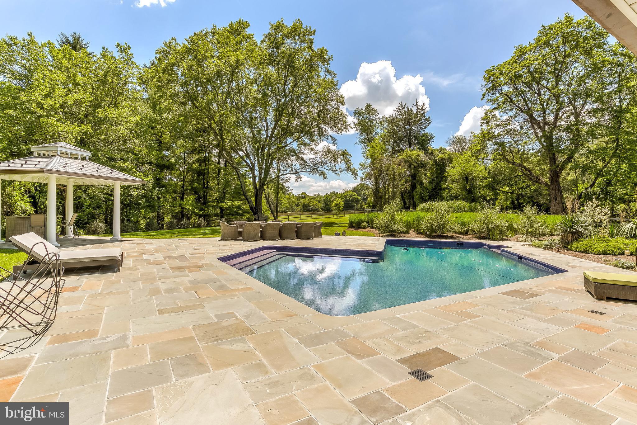 1840 Greenspring Valley Road Stevenson, MD 21153 - Photo 53 of 63 Pool and patios overlooking back yard