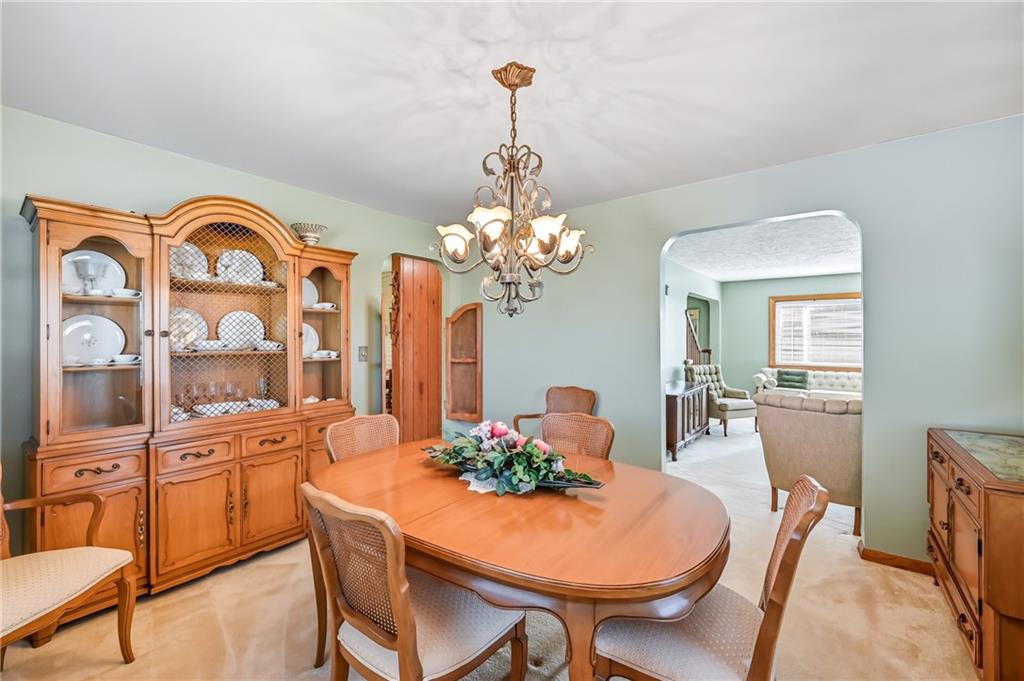 393 South 7th Street Sharpsville, PA 16150 - Photo 13 of 50 a dining room with furniture a chandelier and a rug