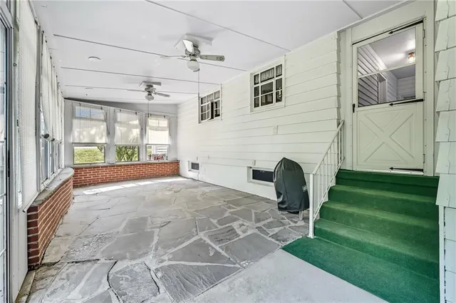 a view of a livingroom with furniture and a fireplace