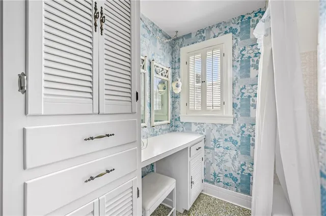 a view of a backyard with table and chairs