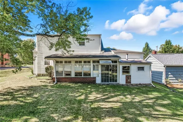front view of a house with a garden