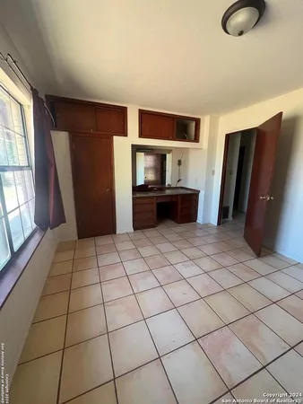 a view of kitchen with furniture wooden floor and window