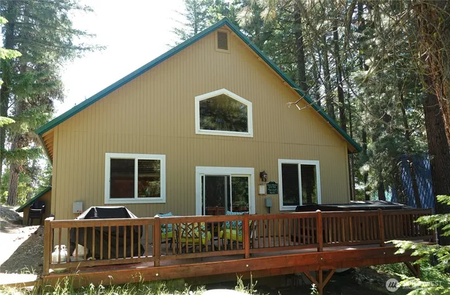 a view of house with a yard