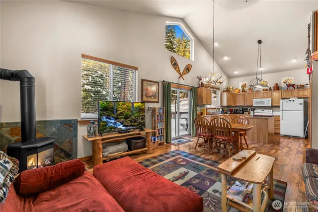 a bedroom with furniture and a flat screen tv