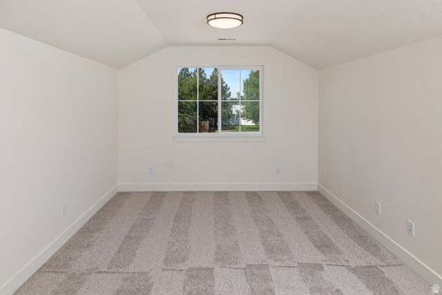 612 North 400 West Logan, UT 84321 - Photo 26 of 27 Carpeted room with a central window and a flush-mount ceiling light fixture