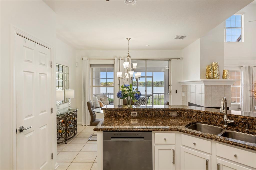 7420 Cypress Grove Road, Unit 132 Orlando, FL 32819 - Photo 13 of 52 a kitchen with granite countertop a sink and cabinets
