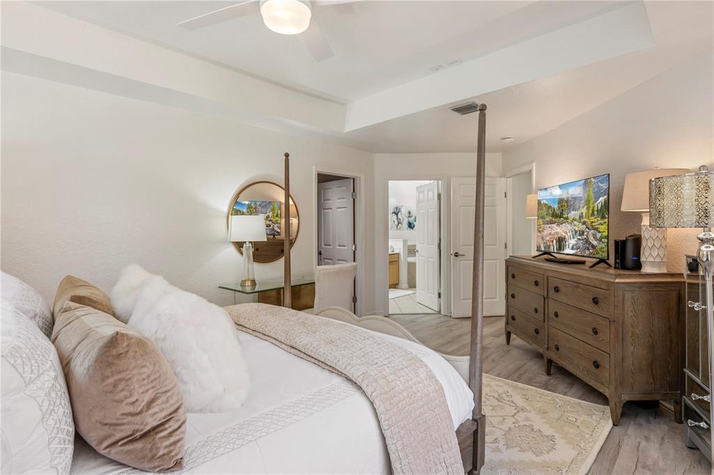 7420 Cypress Grove Road, Unit 132 Orlando, FL 32819 - Photo 15 of 52 a spacious bedroom with a bed and window