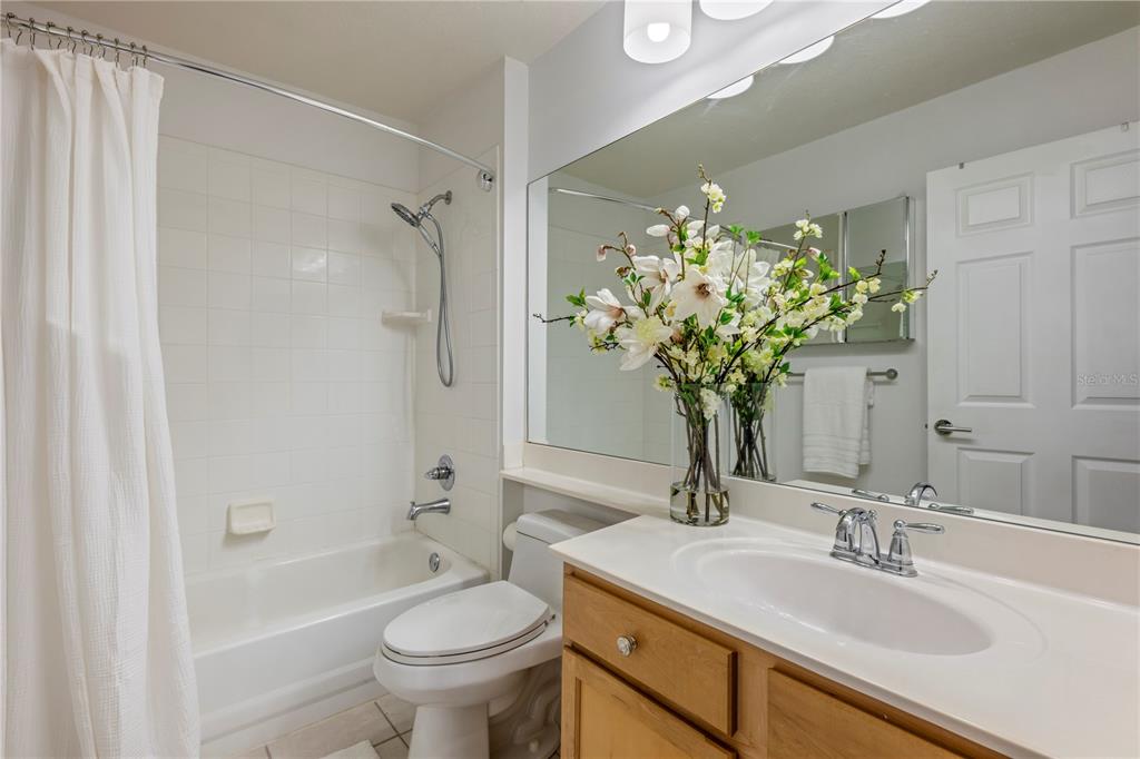 7420 Cypress Grove Road, Unit 132 Orlando, FL 32819 - Photo 19 of 52 a bathroom with a sink a toilet and shower