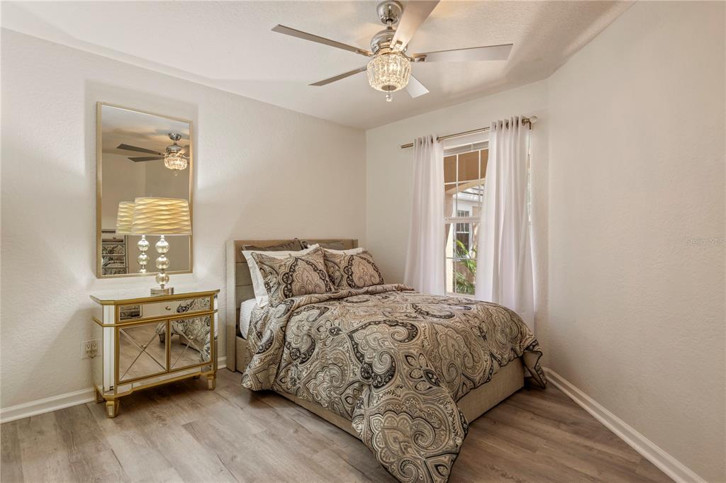 7420 Cypress Grove Road, Unit 132 Orlando, FL 32819 - Photo 20 of 52 a bedroom with a bed and a window