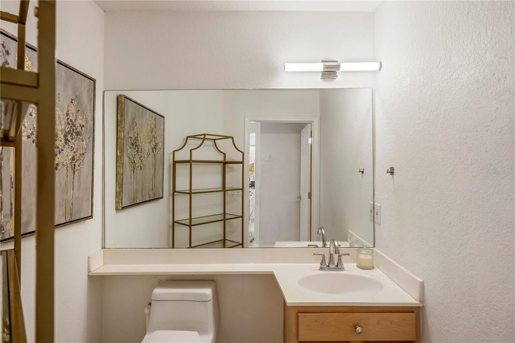 7420 Cypress Grove Road, Unit 132 Orlando, FL 32819 - Photo 22 of 52 a bathroom with a sink a toilet and shower