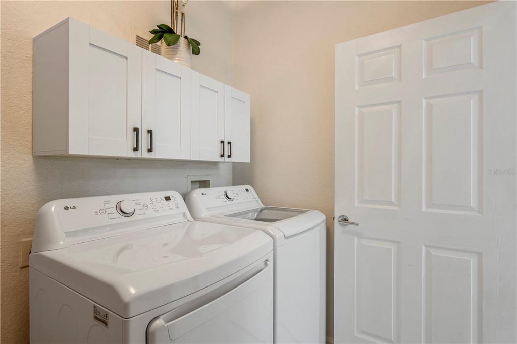7420 Cypress Grove Road, Unit 132 Orlando, FL 32819 - Photo 23 of 52 a utility room with dryer and washer