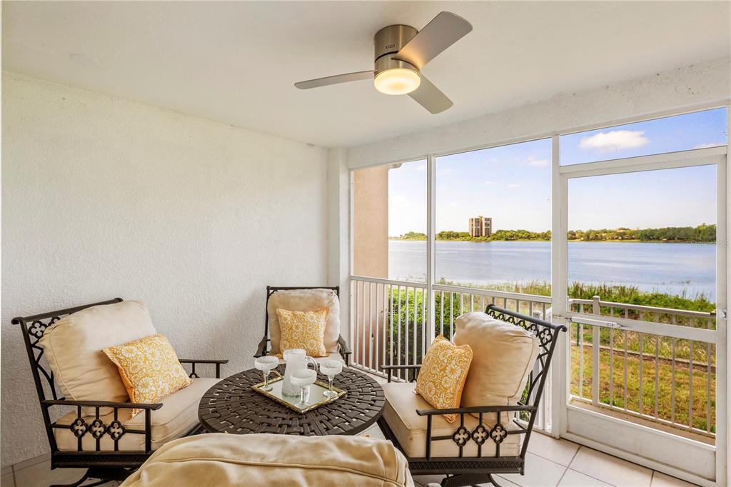 7420 Cypress Grove Road, Unit 132 Orlando, FL 32819 - Photo 24 of 52 a living room with furniture and floor to ceiling windows