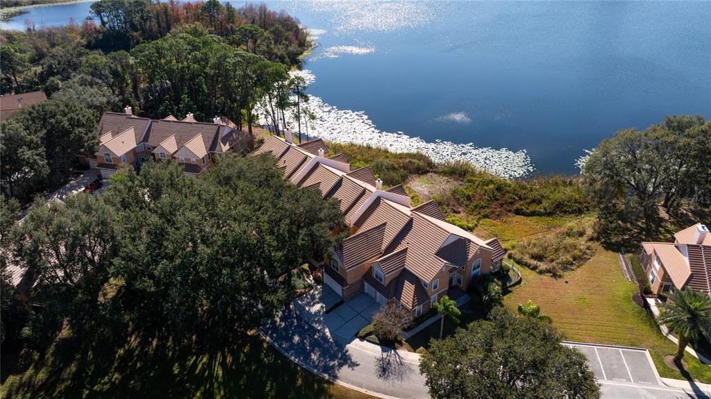 7420 Cypress Grove Road, Unit 132 Orlando, FL 32819 - Photo 34 of 52 an aerial view of houses with yard
