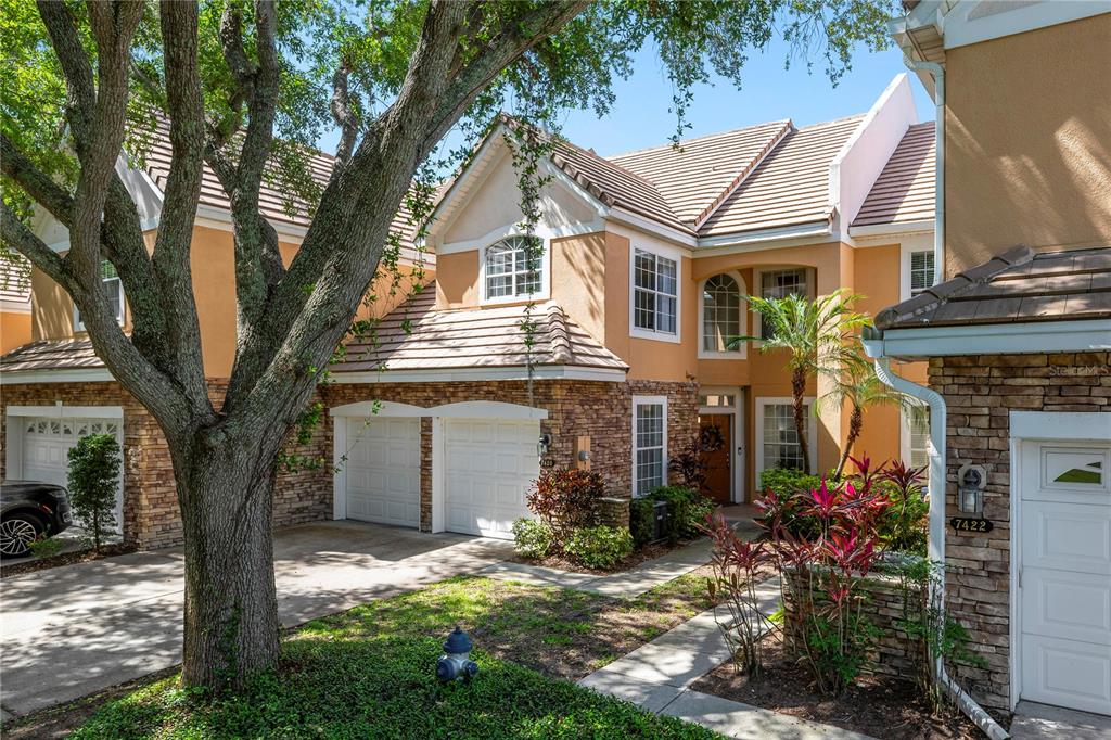 7420 Cypress Grove Road, Unit 132 Orlando, FL 32819 - Photo 46 of 52 a front view of a house with garden