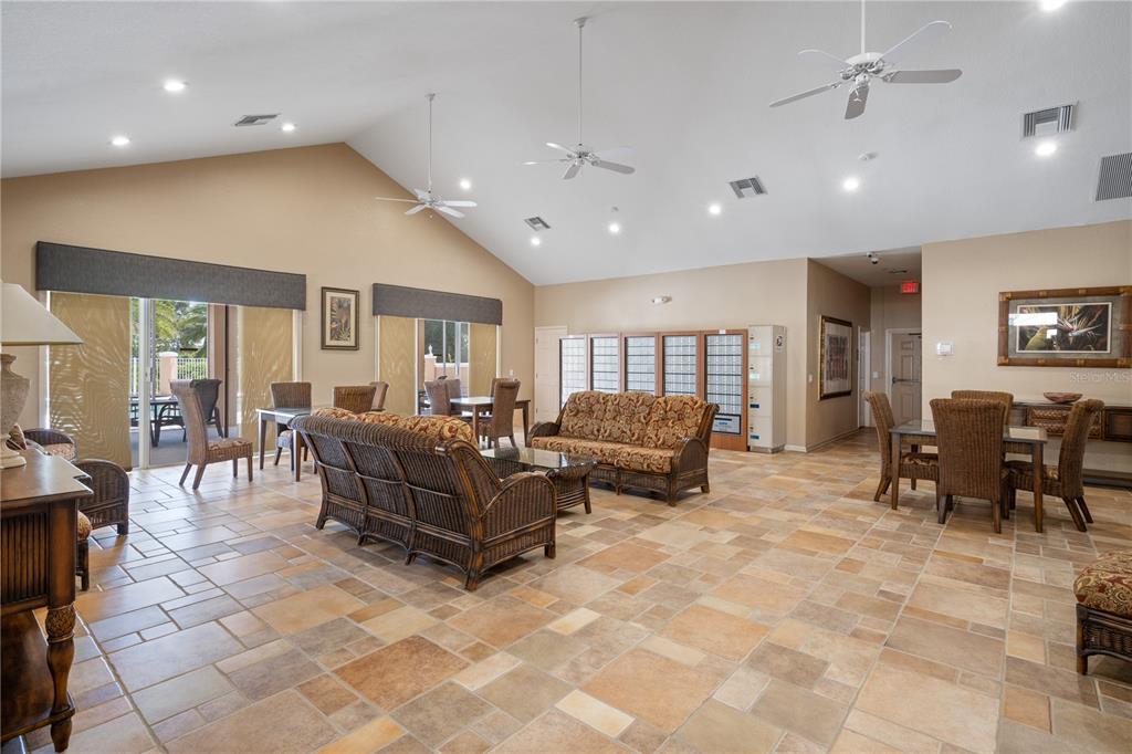 7420 Cypress Grove Road, Unit 132 Orlando, FL 32819 - Photo 48 of 52 a living room with furniture and a table