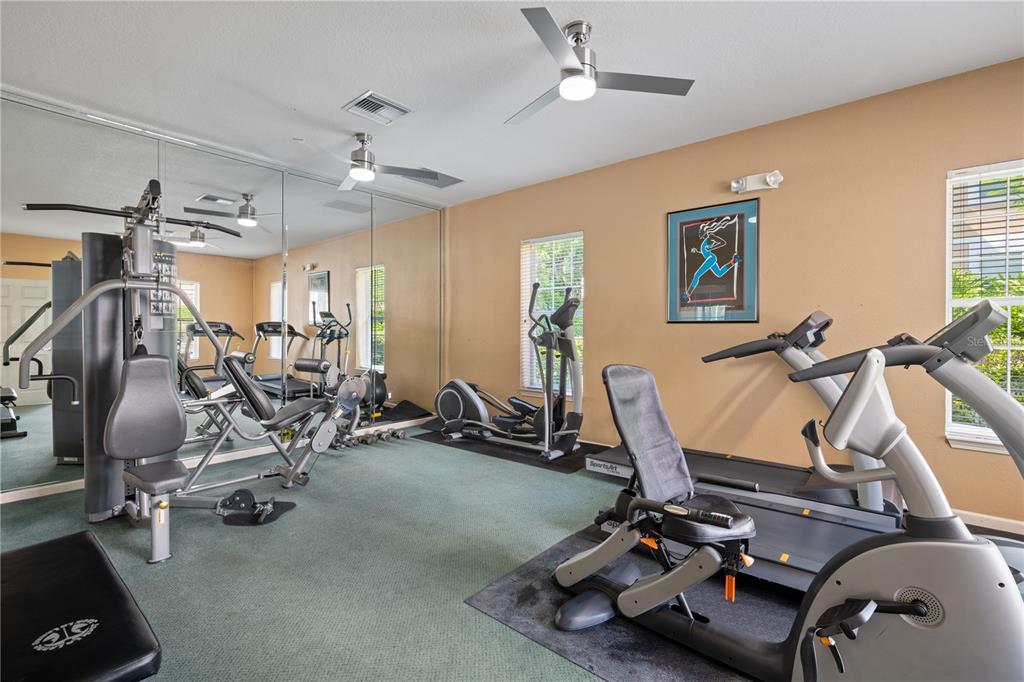 7420 Cypress Grove Road, Unit 132 Orlando, FL 32819 - Photo 49 of 52 a view of a room with gym equipment