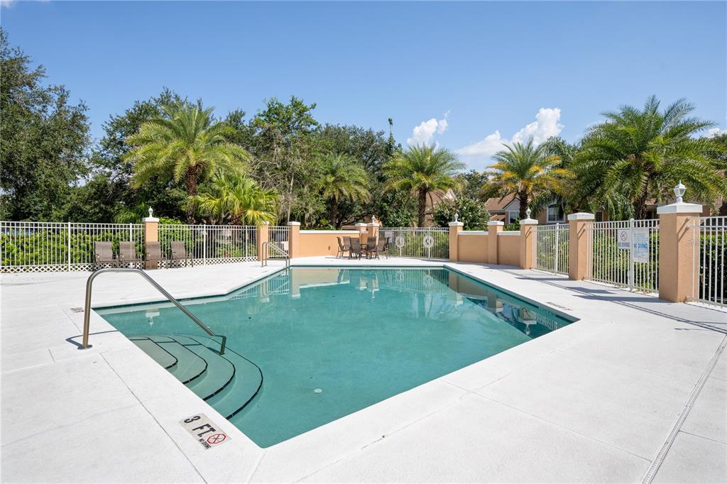 7420 Cypress Grove Road, Unit 132 Orlando, FL 32819 - Photo 51 of 52 a view of a swimming pool with a patio