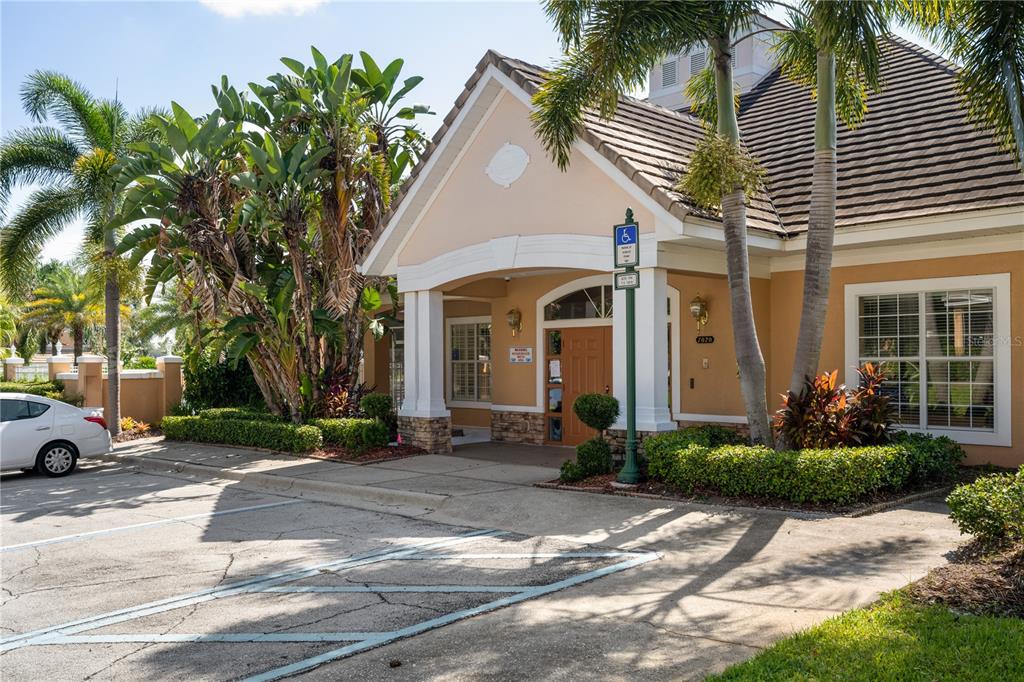 7420 Cypress Grove Road, Unit 132 Orlando, FL 32819 - Photo 52 of 52 a front view of a house with a yard and potted plants