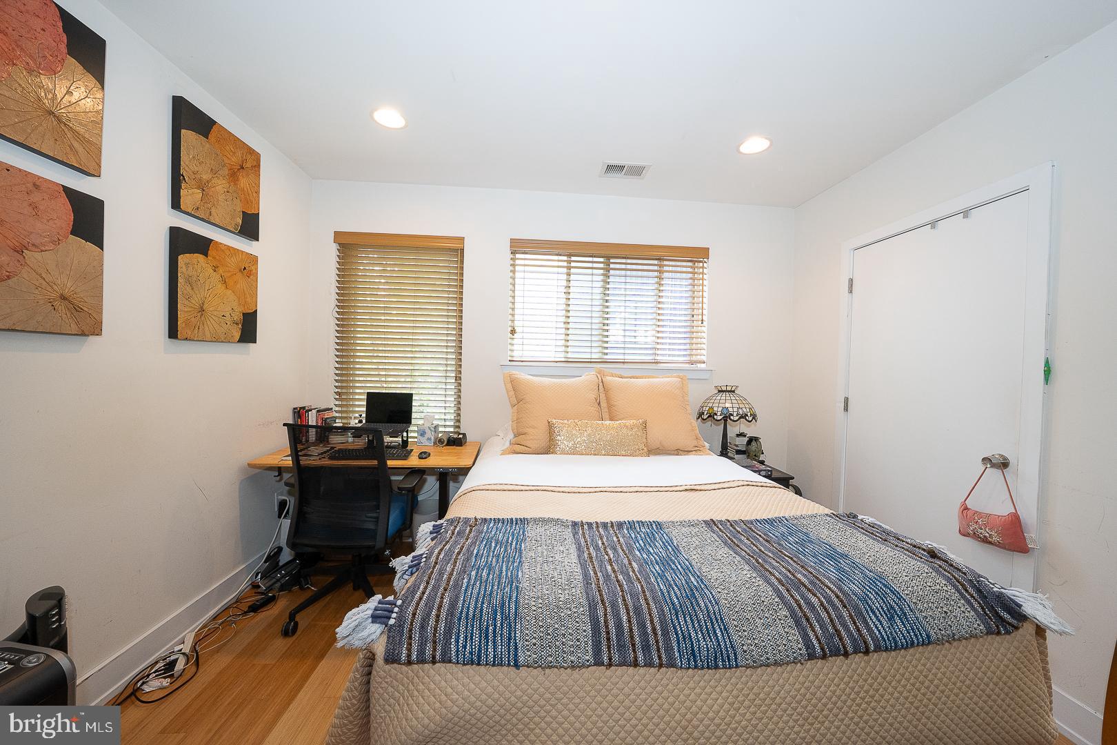 715 Shirley Street, Unit A Philadelphia, PA 19130 - Photo 15 of 24 a bedroom with a bed and wooden floor