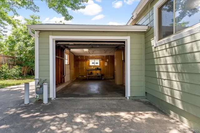 a view of a wooden door and a floor to ceiling window