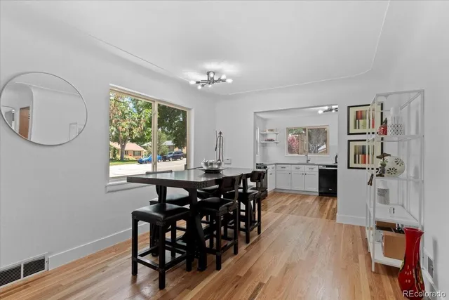 a view of a dining room with furniture window and wooden floor