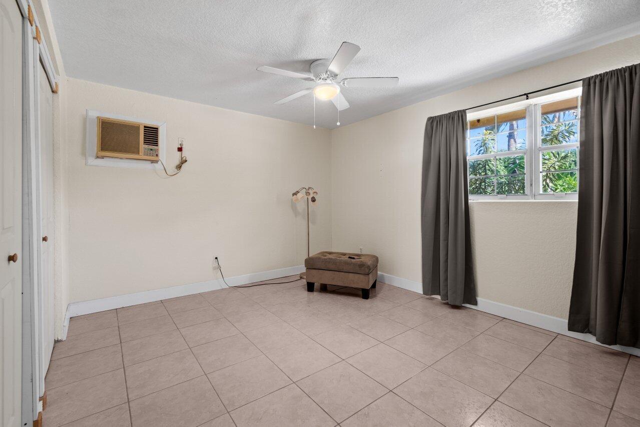 5313 Colbright Road Lake Worth, FL 33467 - Photo 35 of 70 a living room with furniture and a window