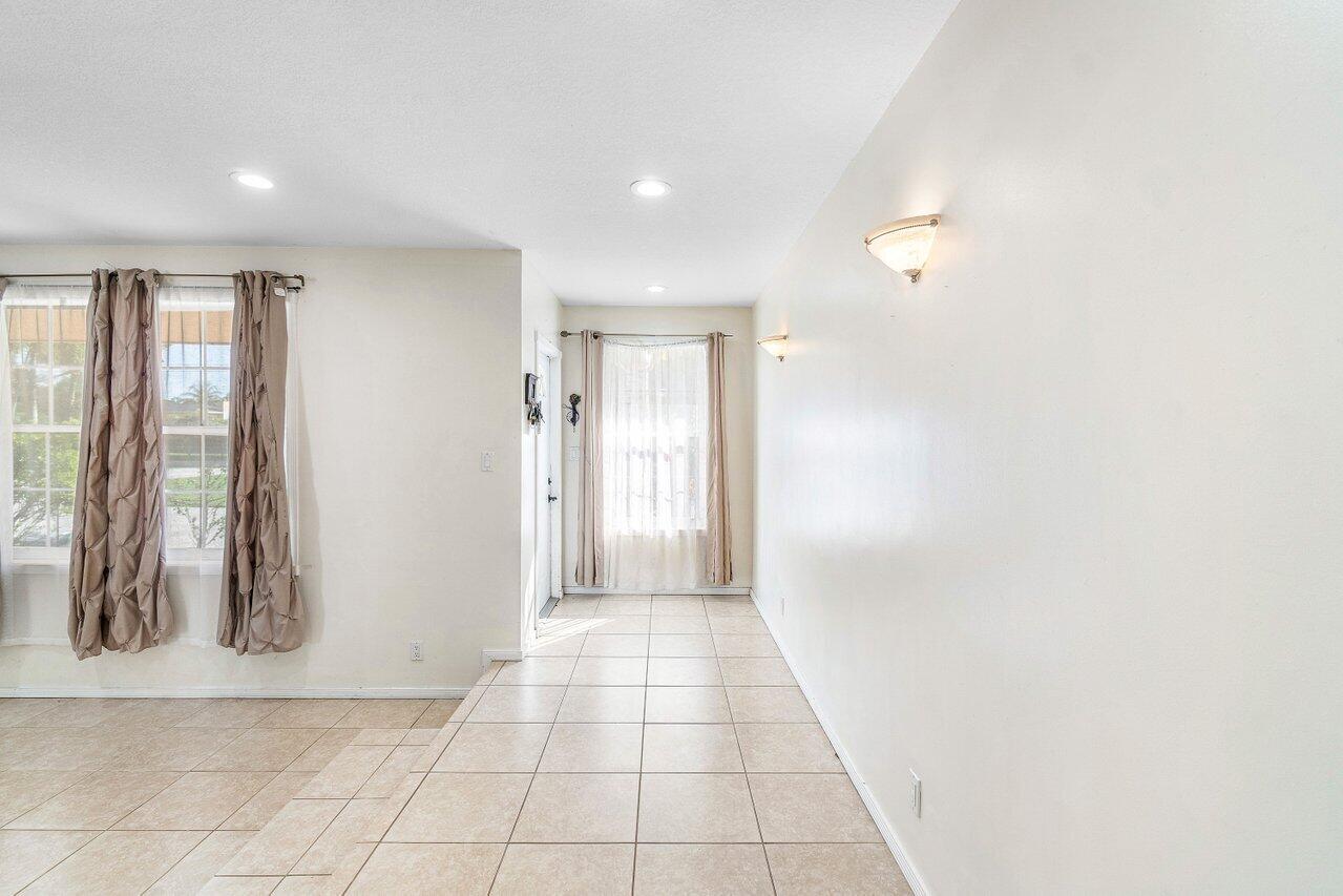 5313 Colbright Road Lake Worth, FL 33467 - Photo 7 of 70 a view of hallway with windows