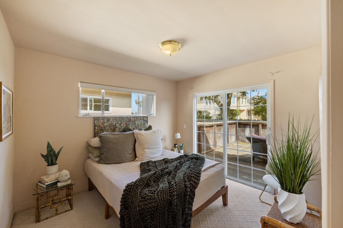 662 Oak Street Monterey, CA 93940 - Photo 12 of 32 a bedroom with a bed and a window