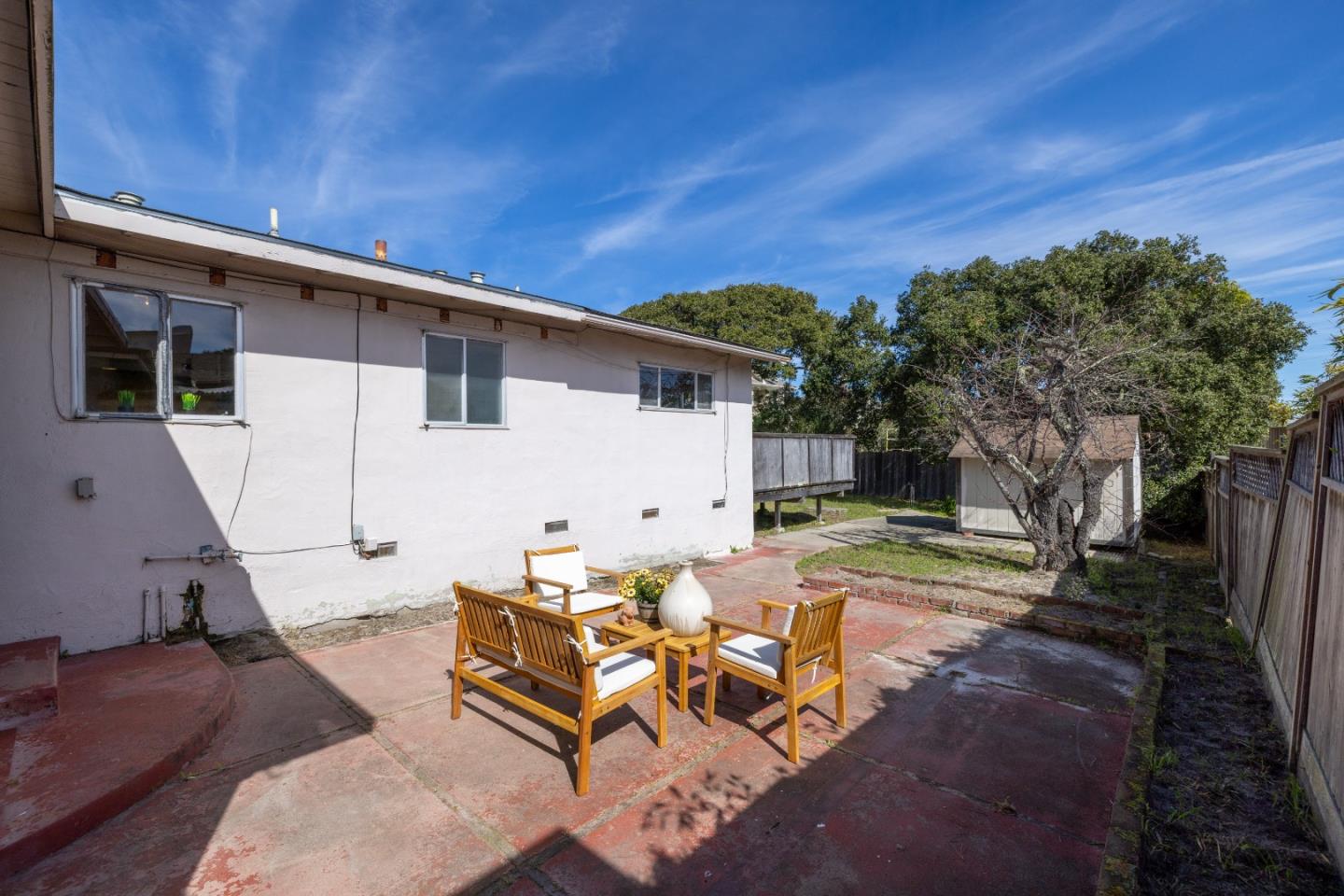 662 Oak Street Monterey, CA 93940 - Photo 24 of 32 a view of a white house with a patio