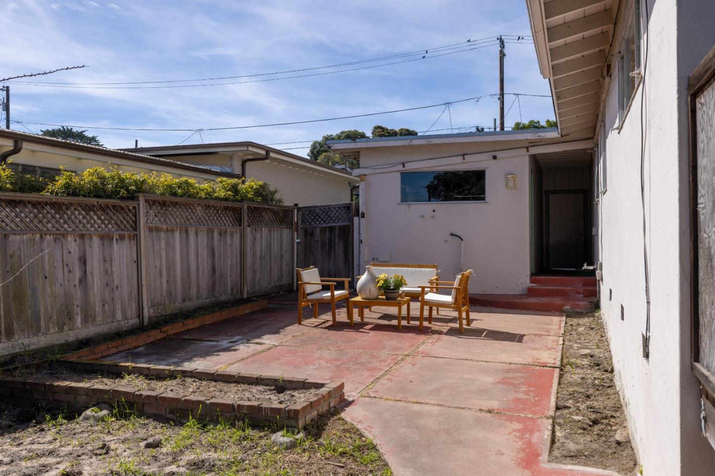 662 Oak Street Monterey, CA 93940 - Photo 25 of 32 a view of a backyard with sitting area