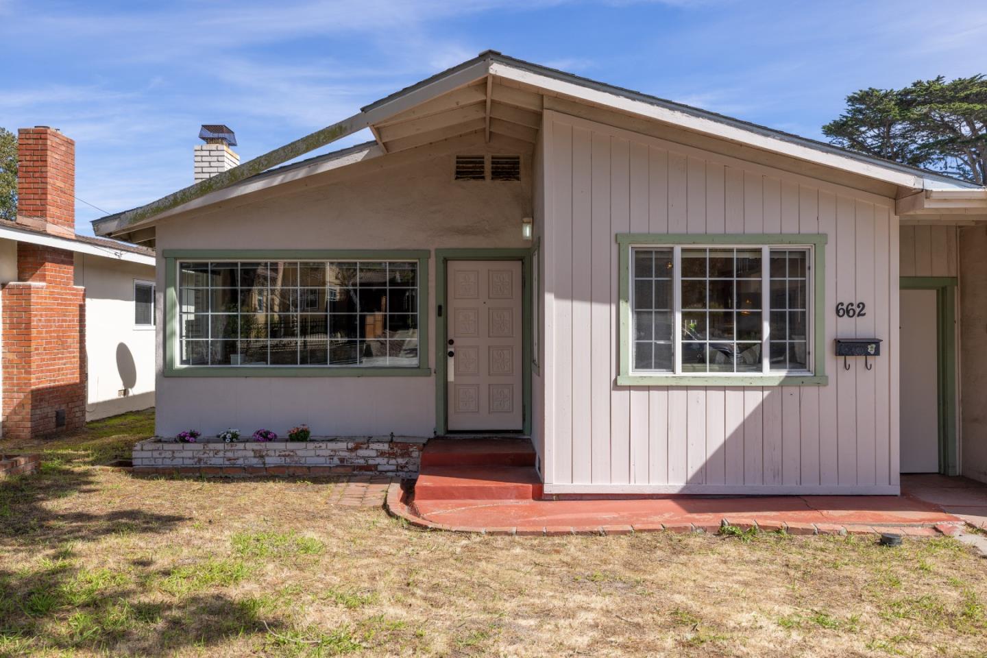 662 Oak Street Monterey, CA 93940 - Photo 30 of 32 a front view of a house with a yard