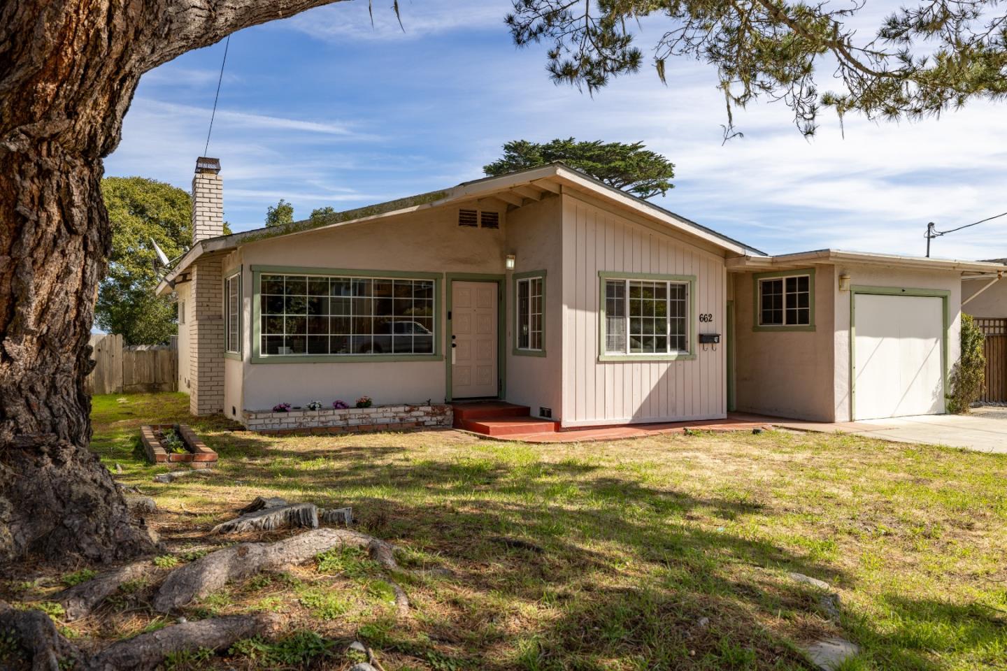 662 Oak Street Monterey, CA 93940 - Photo 31 of 32 a view of a house with backyard and sitting area