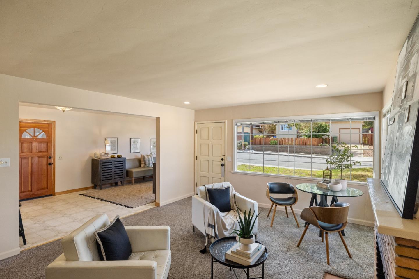 662 Oak Street Monterey, CA 93940 - Photo 5 of 32 a living room with furniture and a large window