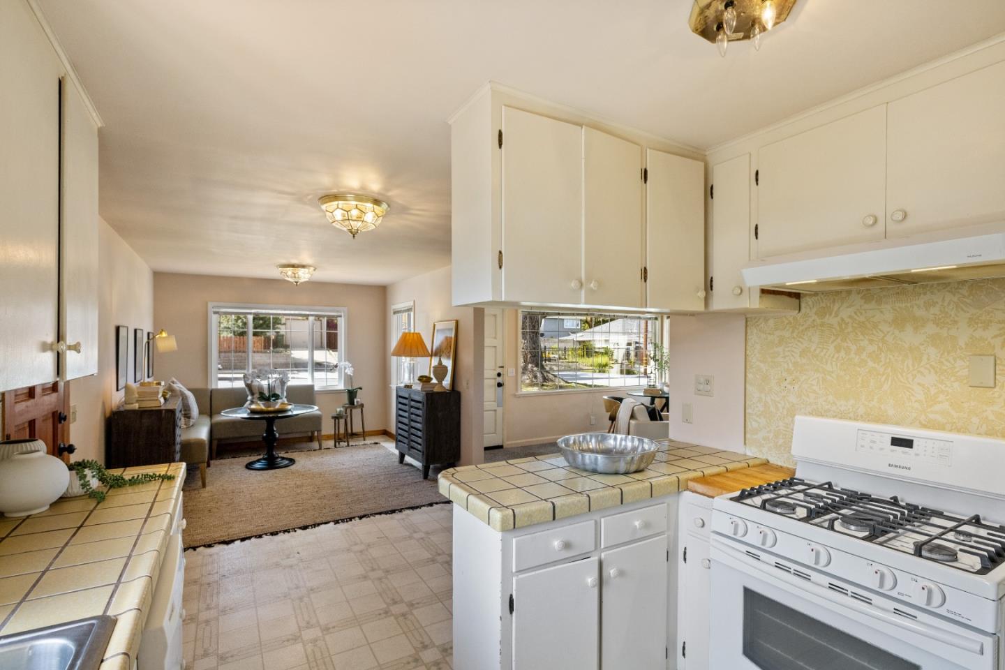 662 Oak Street Monterey, CA 93940 - Photo 10 of 32 a kitchen with a stove and cabinets