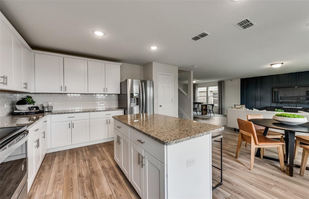 7517 Bent Gale Road Pilot Point, TX 76258 - Photo 9 of 26 *Model Representation - Spacious kitchen with eat-in bartop island