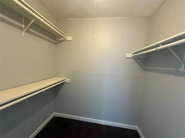 a view of a room with shelf on the wall