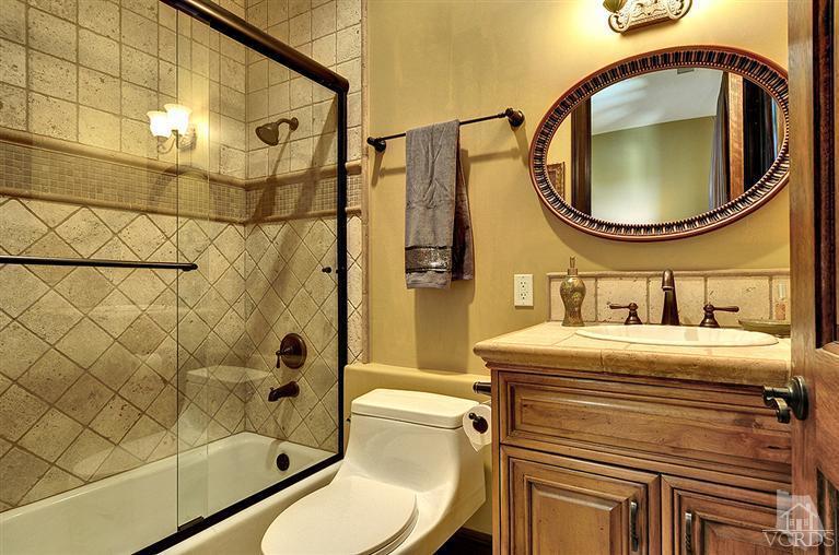 969 North Rancho Road Thousand Oaks, CA 91362 - Photo 14 of 30 a bathroom with a sink a toilet and shower