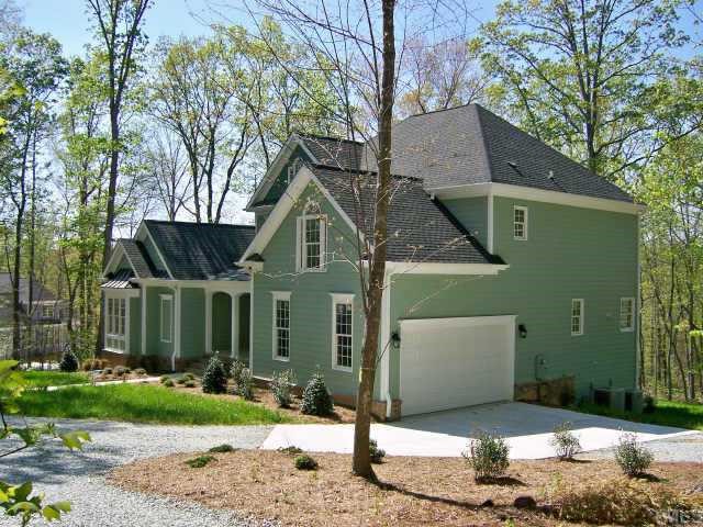 135 Rastille Lane Durham, NC 27712 - Photo 3 of 10 a front view of a house with garden