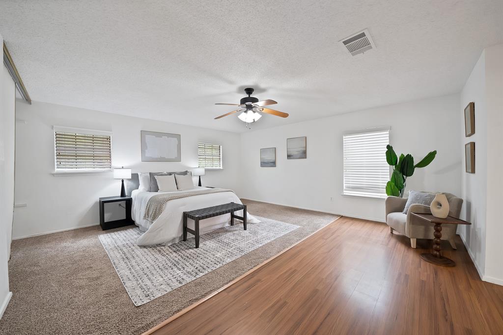 413 Wild Oak Lane Euless, TX 76039 - Photo 16 of 29 a living room with furniture and a chandelier