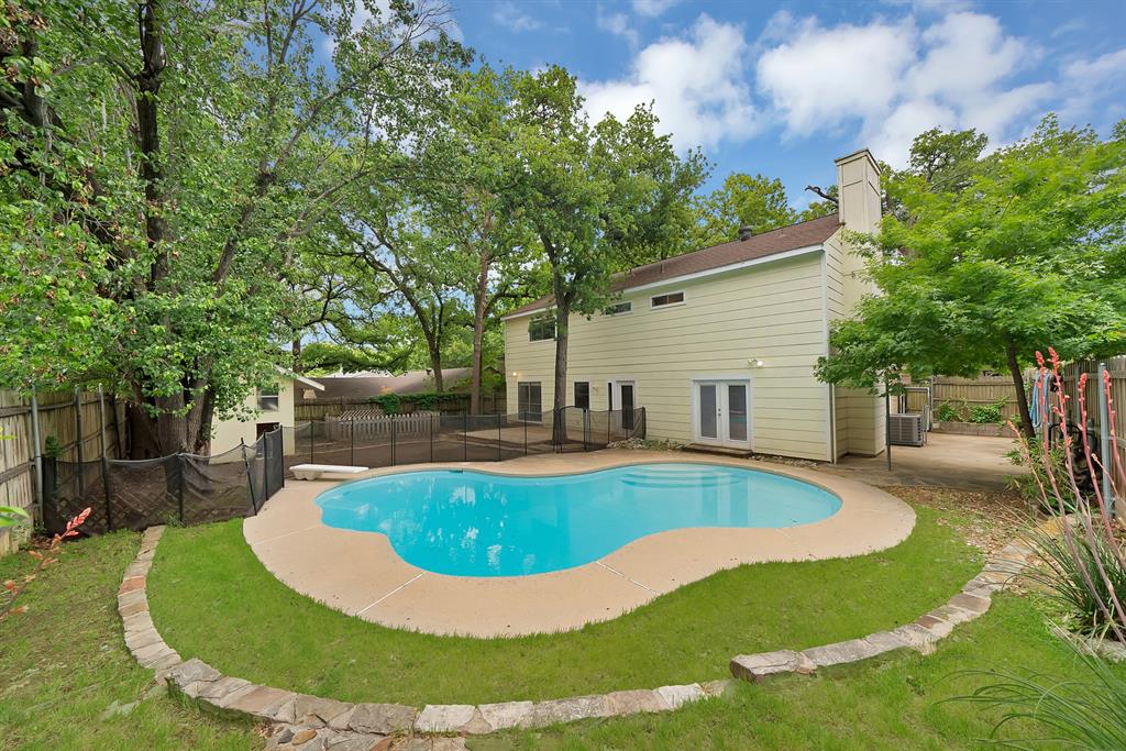413 Wild Oak Lane Euless, TX 76039 - Photo 22 of 29 a view of a swimming pool with back yard