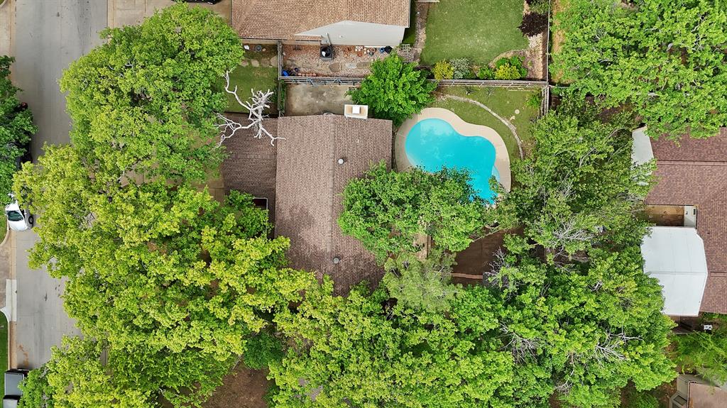 413 Wild Oak Lane Euless, TX 76039 - Photo 25 of 29 an aerial view of a house with a yard and garden