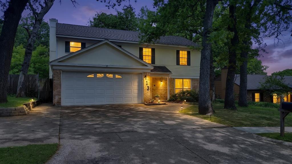 413 Wild Oak Lane Euless, TX 76039 - Photo 27 of 29 a front view of a house with a yard