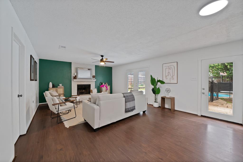 413 Wild Oak Lane Euless, TX 76039 - Photo 4 of 29 a living room with furniture and a wooden floor