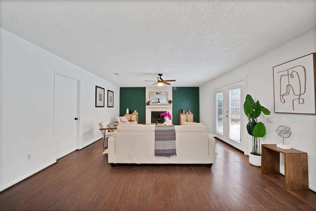 413 Wild Oak Lane Euless, TX 76039 - Photo 5 of 29 a living room with furniture and a wooden floor