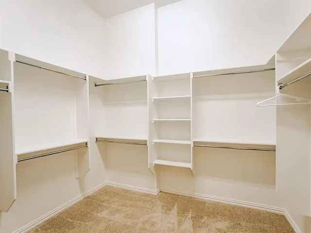 a view of an empty walk in closet