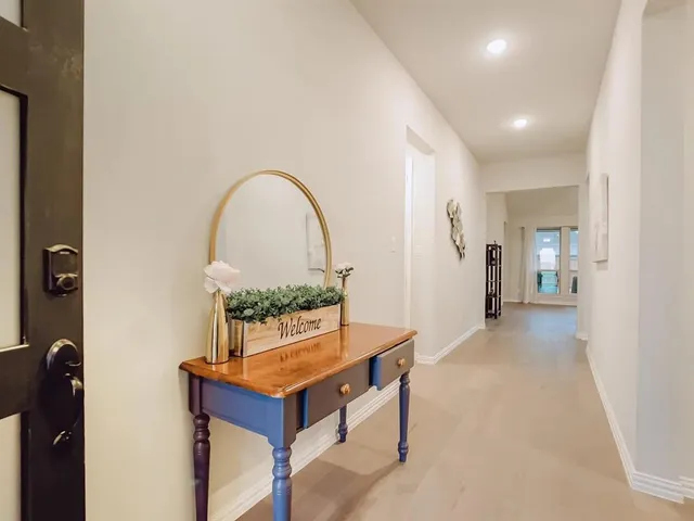 a view of living room with furniture and window