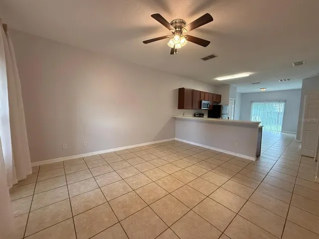 a view of a kitchen with a sink and a chandelier