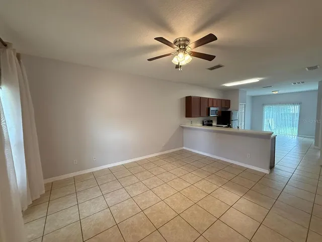 a view of a kitchen with a sink and a window