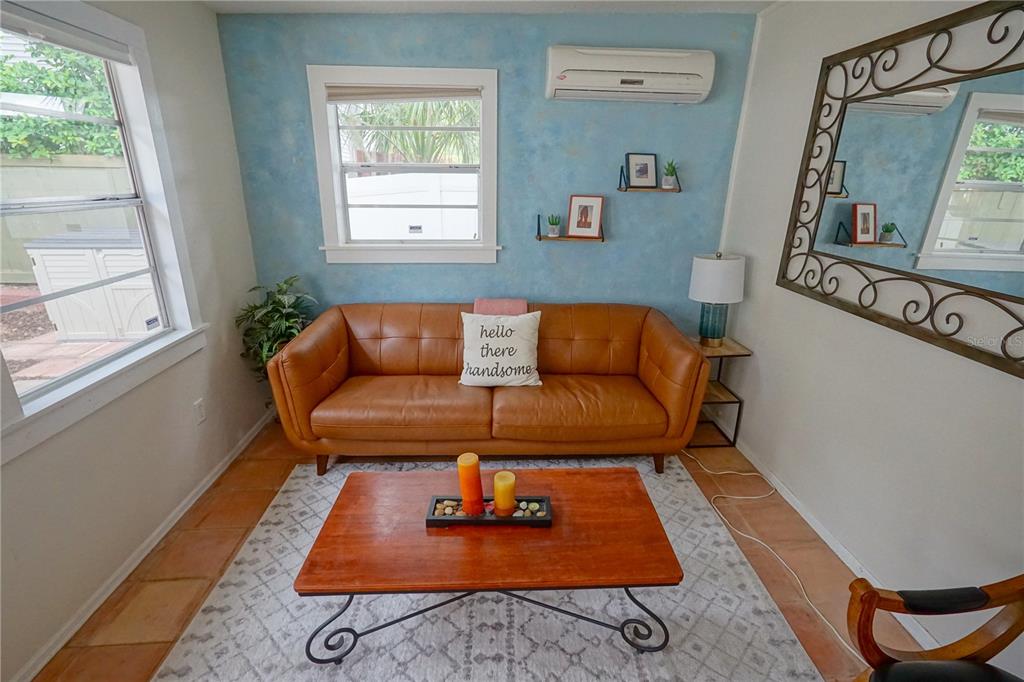 229 East 6th Avenue Mount Dora, FL 32757 - Photo 18 of 65 a living room with furniture and a rug