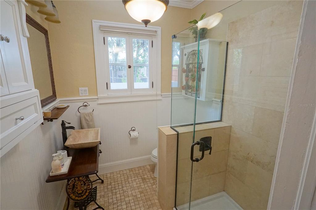 229 East 6th Avenue Mount Dora, FL 32757 - Photo 19 of 65 a bathroom with a shower